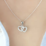 Heartland 10K White Gold 1/8 Cttw Diamond Double Interlocking Hearts Pendant