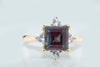 Stunning Created Alexandrite and Created White Sapphire Ring Set In Elegant 10K Rose (Pink) Gold